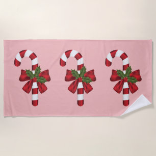 Three Christmas Candy Canes On Pink Beach Towel