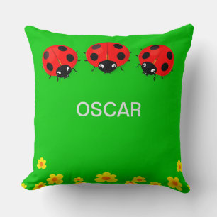 Three Colourful Ladybugs on Green Background Cushion