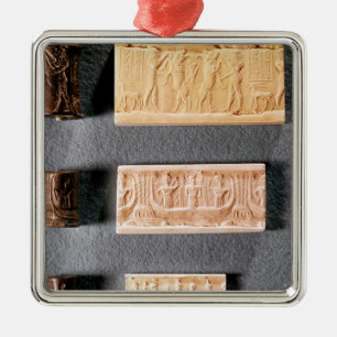 Three cylinder seals with impressions, metal tree decoration