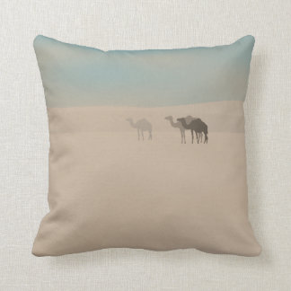 Three dromedary camels walking in Sahara desert Cushion