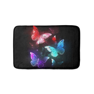 Three Glowing Butterflies on night background Bath Mat