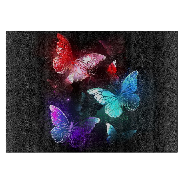 Three Glowing Butterflies on night background Cutting Board (Front)