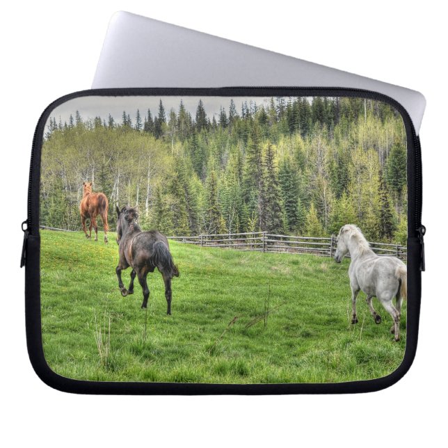 Three Horses Running on Fresh Grass in a Paddock Laptop Sleeve (Front)