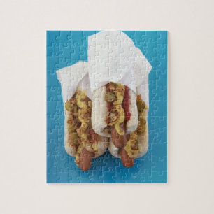 Three hot dogs in buns jigsaw puzzle