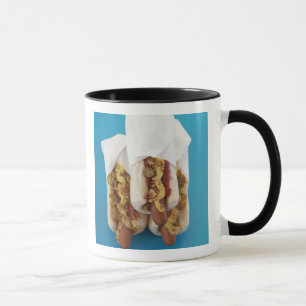 Three hot dogs in buns mug