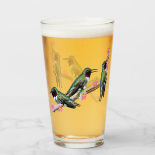 Three Hummingbirds perched on a branch of a Floss Glass