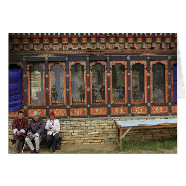 Three men sit on a bench at the Memorial Chorten (Front Horizontal)