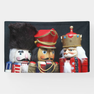 Three nutcrackers on dark background banner