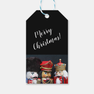 Three nutcrackers on dark background gift tags
