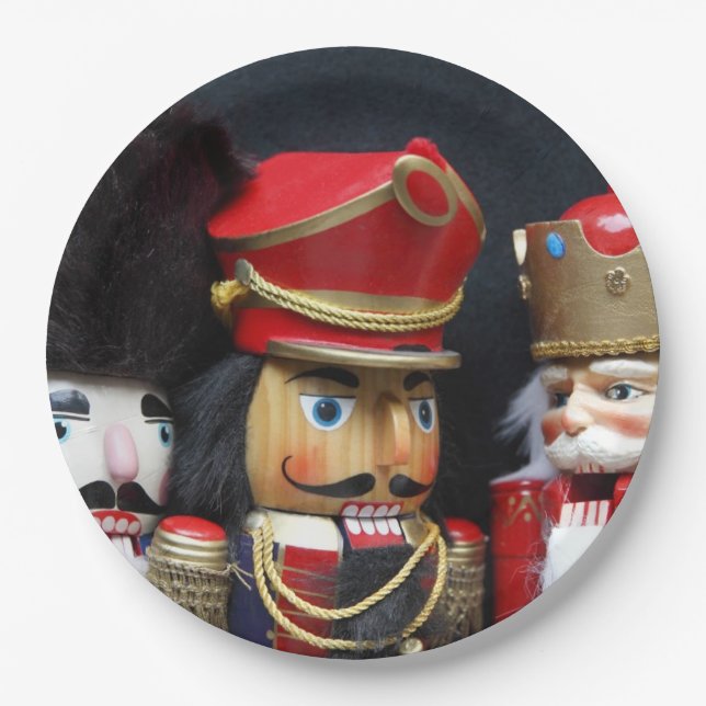 Three nutcrackers on dark background paper plate (Front)