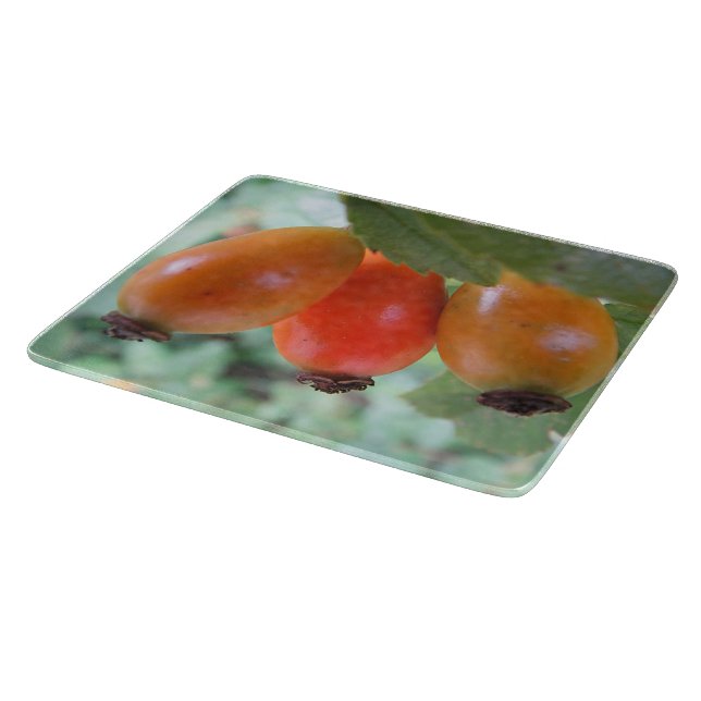 Three orange rosehips cutting board (Corner)