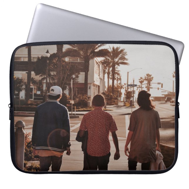 Three persons walking near palm trees laptop sleeve (Front)