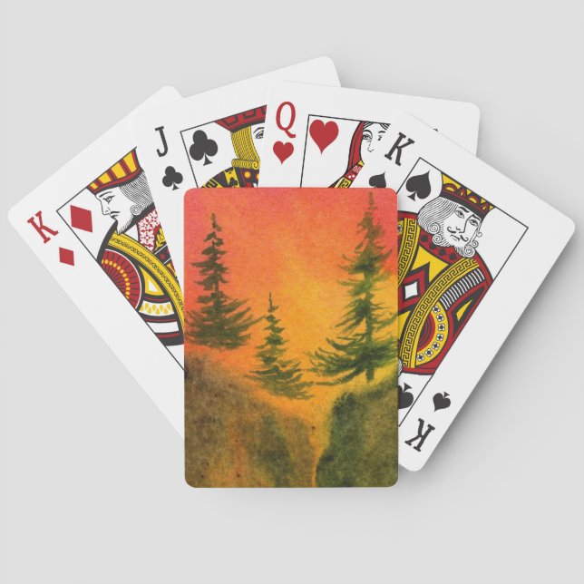Three pines at fiery sunrise on a sheer cliff playing cards (Back)