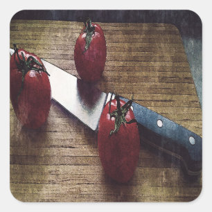 Three red tomatoes on a chopping board   square sticker