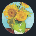 Three Sunflowers | Vincent van Gogh Classic Round Sticker<br><div class="desc">Three Sunflowers (1888) by Vincent van Gogh is a vibrant still life that showcases the artist’s signature thick brushstrokes and bold use of colour. The painting features three sunflowers in a simple vase, their golden petals contrasting against the aqua blue background. Van Gogh's vivid yellow palette brings energy and life...</div>