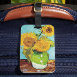 Three Sunflowers | Vincent van Gogh Luggage Tag<br><div class="desc">Three Sunflowers (1888) by Vincent van Gogh is a vibrant still life that showcases the artist’s signature thick brushstrokes and bold use of colour. The painting features three sunflowers in a simple vase, their golden petals contrasting against the aqua blue background. Van Gogh's vivid yellow palette brings energy and life...</div>