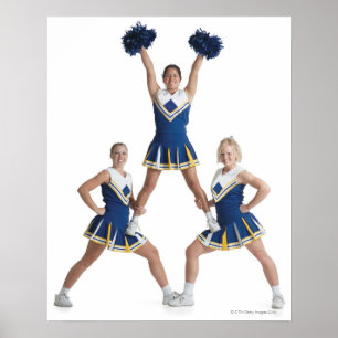 three teenage caucasian female cheerleaders in poster
