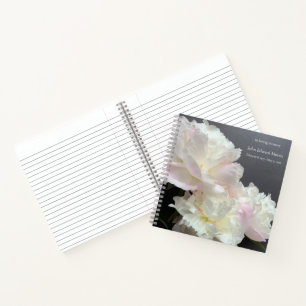 Three white peonies on dark grey memorial notebook