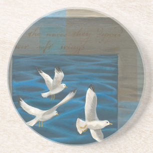Three White Seagulls Flying Over the Water Coaster