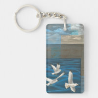 Three White Seagulls Flying Over the Water