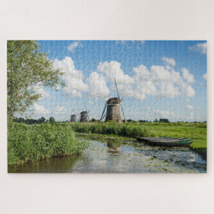 Three windmills and a canal with boats in Holland Jigsaw Puzzle