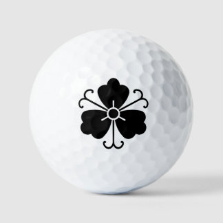 Three wisteria blooms with vines golf balls
