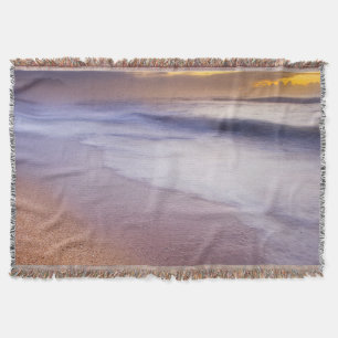 Throw blanket with image of sunrise over ocean