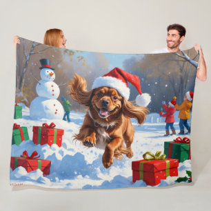 Tibetan Spaniel Running in Snow with Christmas Hat Fleece Blanket