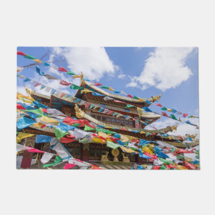 Tibetan Temple with prayer flags - Yunnan, China Doormat