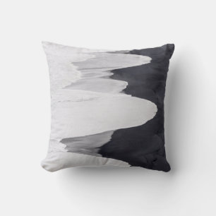 Tide Washes Over Black Beach Cushion