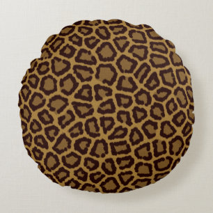 Tile background with a leopard fur round cushion