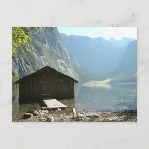 Timber house by a lake postcard