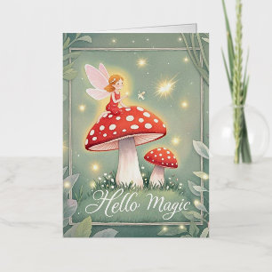 Tiny fairy perched on top of mushroom and glowing foil greeting card