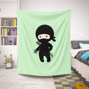 Tiny Ninja Holding Throwing Star on Green Sherpa Blanket