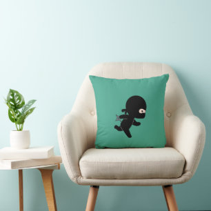 Tiny Ninja Running On Dark Geen Cushion