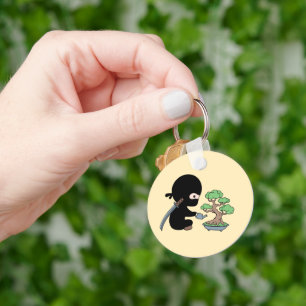 Tiny Ninja Watering Bonsai Tree on Yellow Key Ring