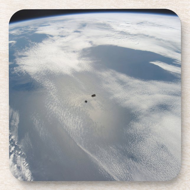 Tiny Satellites Orbit Above A Part Of Earth. Coaster (Front)