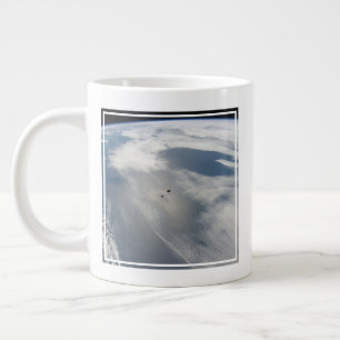 Tiny Satellites Orbit Above A Part Of Earth. Large Coffee Mug