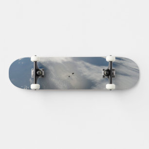 Tiny Satellites Orbit Above A Part Of Earth. Skateboard