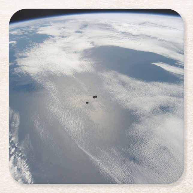 Tiny Satellites Orbit Above A Part Of Earth. Square Paper Coaster (Front)
