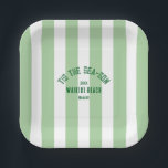 Tis The SeaSon Custom Beach Christmas Green Stripe Paper Plate<br><div class="desc">The ’Tis The Sea-Son Custom Beach Christmas Green Stripe Paper Plates add festive flair and seaside charm to your holiday celebrations. Featuring a playful green cabana stripe design with customisable beach name and year, these durable paper plates are perfect for serving meals, appetizers, or desserts. Convenient and disposable yet stylish...</div>