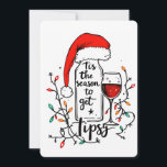 'Tis The Season to Get Tipsy  Holiday Card<br><div class="desc">A playful and festive Christmas design showcasing an empty wine bottle topped with a Santa hat, accompanied by a glass of red wine. Both are wrapped in twinkling Christmas lights, with the handwritten text: "Tis the season to get tipsy." This cheerful design is available on a range of products, perfect...</div>