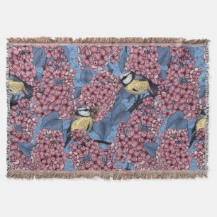 Tit birds in the lilac garden throw blanket