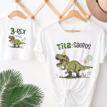Tita-saurus Dinosaur Theme Fun Kids Birthday Party T-Shirt<br><div class="desc">This super cute Tita-saurus women's unisex t-shirt, designed to match kid's birthday years 1-5, matching family dino designs, is the perfect Aunt tee to wear at your little one's fun Jurassic dinosaur theme birthday party - super cute family photo keepsake moment! Design features a roaring t-rex dinosaur cartoon wearing a...</div>