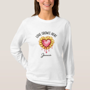 🔹 Title Love Grows Here – Sunflower Heart Typogr T-Shirt