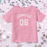 Toddler Girl Name Jersey Number Sports Pink Cotton Toddler T-Shirt<br><div class="desc">Create your own custom, personalised, cool, unisex sizing, modern, stylish white typography / font / script, monogrammed player name jersey number girly baby pink, 100% combed ring spun fine jersey soft cotton t-shirt tee shirt. Simply type in your name / kids name / player name and player jersey number, to...</div>