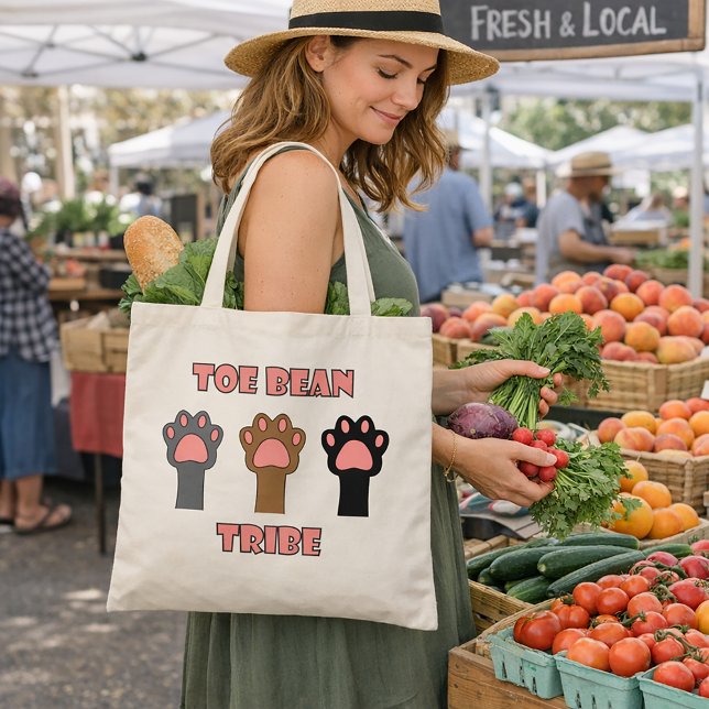 Toe Bean Tribe Cute Cat Paws Tote Bag (A tote bag with three cat paws and the words toe bean tribe in pink with a gray outline.)