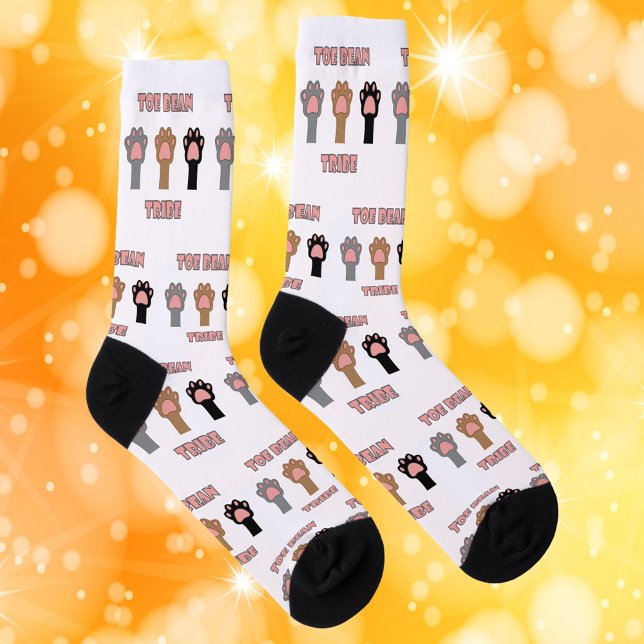 Toe Bean Tribe Funny Cat Paws Pink Letters Socks (A pair of socks featuring cat paws and the words toe bean tribe in pink and gray.)