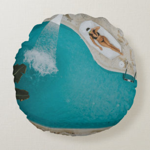 Top-angle photography of outdoor swimming pool round cushion