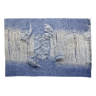 Torn blue denim: jeans texture. pillowcase